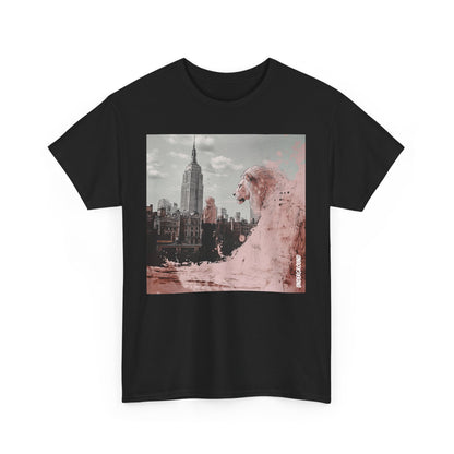 Black Graphic T-shirt of a Striking ink and pastel illustration of a woman standing before a city backdrop, gazing at a massive pink lion overlooking the skyline. A fusion of urban energy and surreal artistry.