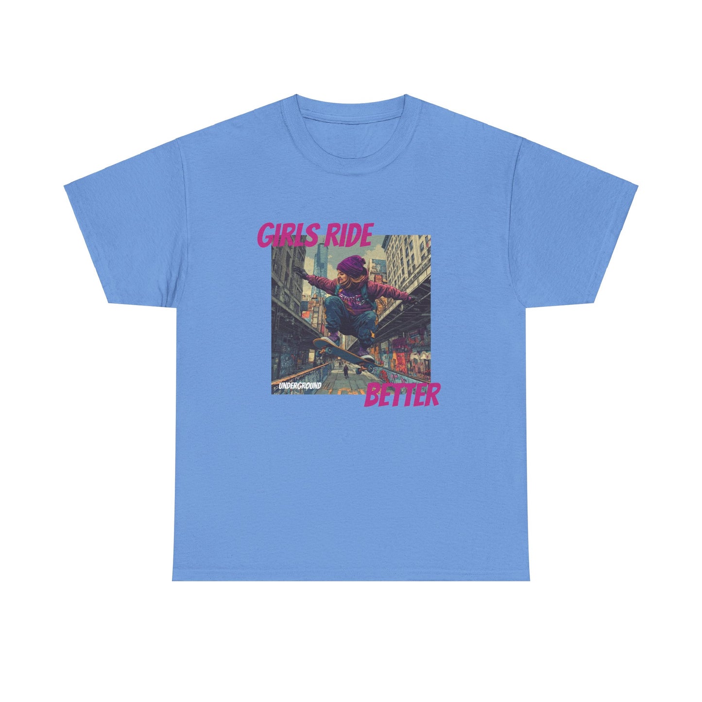 blue Graphic T-shirt with an Image of a Gritty, colorful street-inspired artwork of a girl riding a skateboard, wearing a purple snow hat and a streetwear hoodie. Bold urban expression with the slogan "Girls Ride Better."