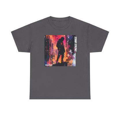 grey Graphic T-shirt with an image of a Hooded man standing strong on a building ledge with a vibrant city skyline in the background. Bold, street-culture-inspired artwork with striking colors.